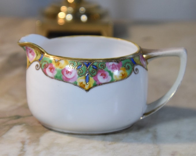 Small antique hand painted creamer with gold trim and pink and yellow roses. Hand painted in early century Japan (Nippon) EUC!