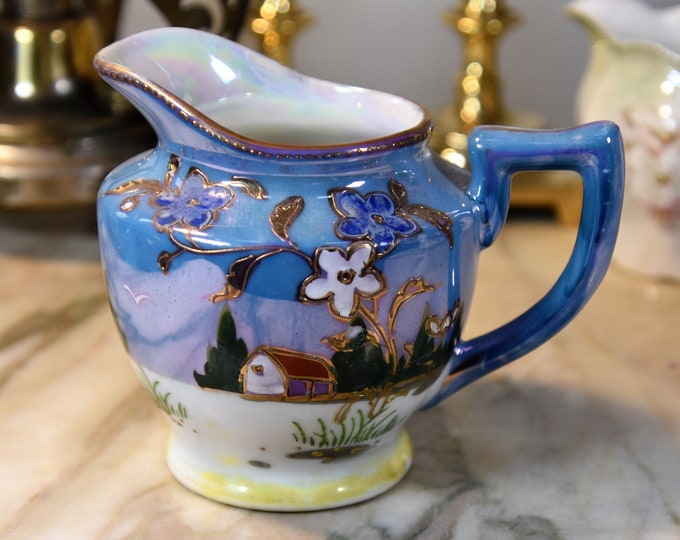 Small antique blue luster-ware creamer/pitcher with gold trim and hand painted exquisite details. Stamped  Takito Co dating 1920-1930