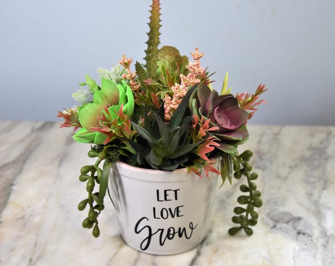 4" planter with the message "Let Love Grow" filled with hand-painted and airbrushed Sola wood succulents - no watering needed! Great Gift!