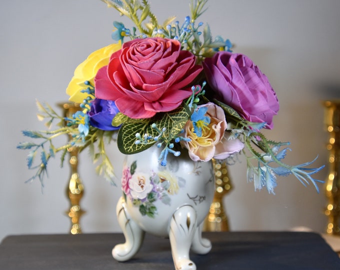 Beautiful hand-painted, footed, antique, egg shaped vase filled with airbrushed Sola wood roses