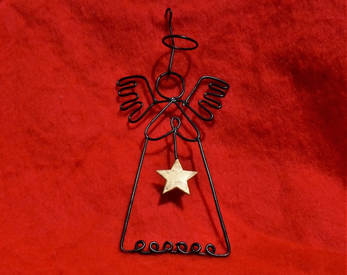 Vintage Christmas ornament, black coated wire twisted into a angel shape with a brass star - from a New England estate