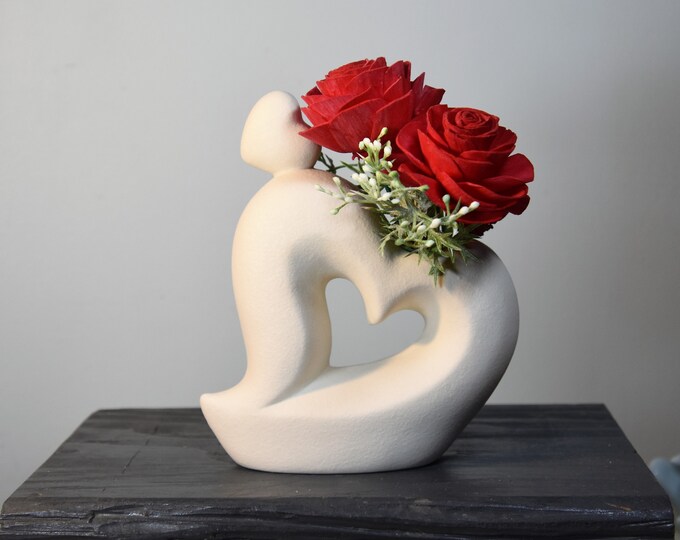 White curvy hearts vase with 4 red (or another color) Sola wood roses that will last forever!  Valentine, romance, sexy