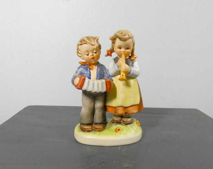 Goebel Hummel Birthday Serenade - Boy And Girl Playing Musical Instruments- by M I Hummel 1965 from a New England Estate