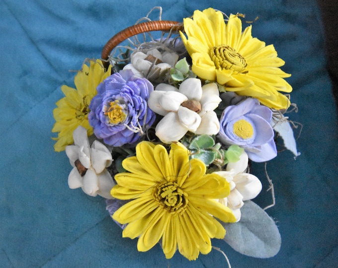 Vintage small wicker baby carriage with Sola wood flower arrangement- pastel yellow, light purple, natural white and skin wood