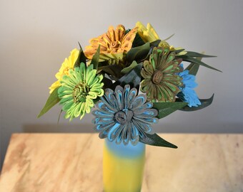 A Touch of Tropical! Sun yellow, grass green and spa blue vase filled with coordinating sustainable Sola daisies