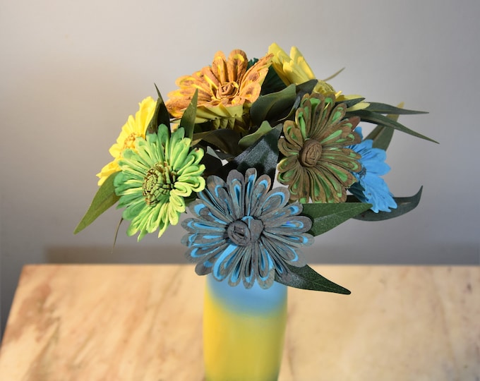 A Touch of Tropical! Sun yellow, grass green and spa blue vase filled with coordinating sustainable Sola daisies