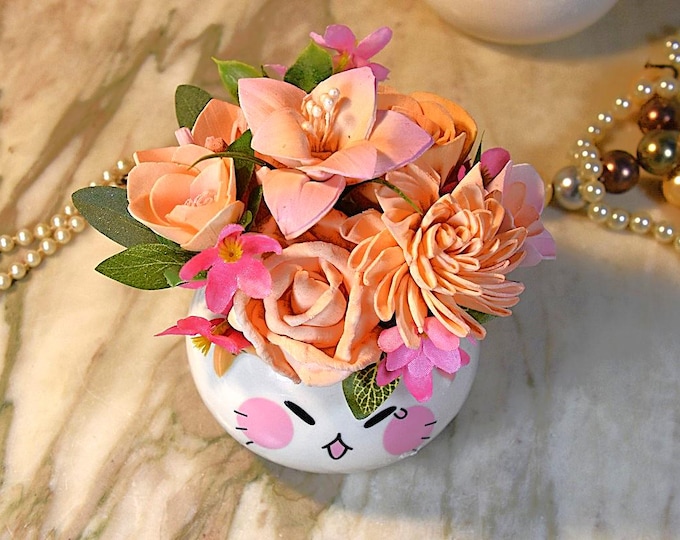 Adorable kitty cat planter with pink and peach flowers