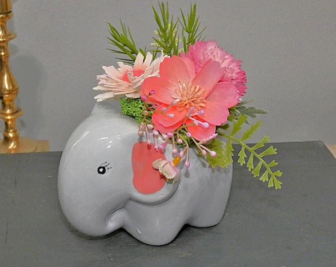 Adorable ceramic elephant vase with Sola flower arrangement - great way to brighten any small corner