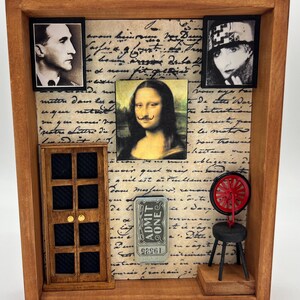 May include: A wooden shadow box with a vintage theme. It features miniature portraits, a door, a ticket, and a small stool with a red wheel. The background is a handwritten script.