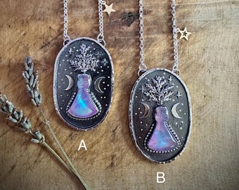 The Potion - Sterling silver with a carved Aurora Opal and crystal cabochon. Hallmarked. Chain 20inch with a lobster fastening and charm