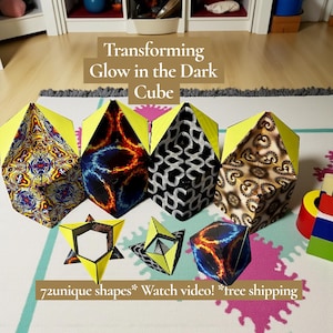 May include: A collection of transforming glow-in-the-dark cubes with various patterns and colors, including yellow, blue, red, and black. The image also shows the cubes in different shapes and the text "72 unique shapes".