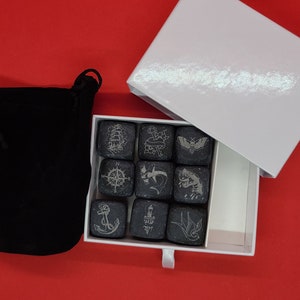 Whiskey stone set engraved with tattoo designs.