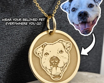 May include: Gold necklace with a round pendant featuring an engraved image of a dog's face. The text "WEAR YOUR BELOVED PET EVERYWHERE YOU GO" is visible at the top of the image.