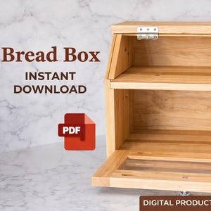 May include: A wooden bread box with a hinged lid and a clear glass panel on the door. The text "Bread Box" and "Instant Download" are displayed. A red PDF icon is also visible. The words "Digital Product" are at the bottom.