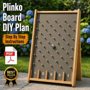 Puede incluir: Un tablero de Plinko de madera con una superficie de juego gris y clavijas de madera. El tablero tiene una bola plateada en juego y ranuras numeradas en la parte inferior. El texto en el tablero dice "Plinko Board DIY Plan" y "Step By Step Instructions".