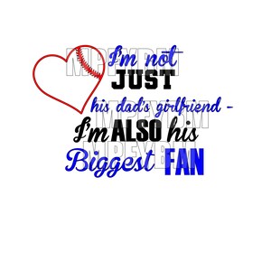 May include: A red heart with a baseball graphic inside. The text "I'm not just his dad's girlfriend - I'm also his biggest fan" is written in black and blue text.