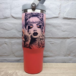 May include: A red stainless steel tumbler with a black and white graphic of a woman with a leopard print headband. The tumbler has a grey lid with a handle and the text "So Appalled I'm Drawing" on the side.