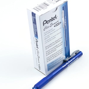 May include: A blue retractable pen-shaped eraser with a white eraser tip. The packaging shows the text "Pentel Clic Eraser Grip" and says it is retractable for all pencil lead markings. The text "ZE22-C" is also visible on the packaging.