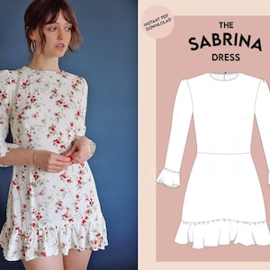 May include: A white dress with a floral print and a ruffled hem. The dress has a round neckline and long sleeves with ruffles at the cuffs. The dress is shown on a model with a blue background. The text "The Sabrina Dress" is shown in the image.