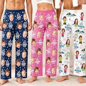 May include: Three pairs of personalized pajama pants. One pair is navy blue with "Best Dad Ever" and baby faces. Another is pink with "Best Mom Ever" and baby faces. The third is white with "Best Papa Ever" and cartoon figures.