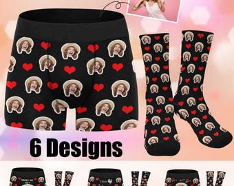 May include: Six different designs of underwear and socks featuring a repeated pattern of a person's face and red hearts. The text "6 Designs" is printed below the underwear and socks.