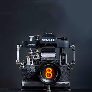 Cyberpunk Nixie Tube Clock Integrated In A Disassembled Mechanical Camera with A Demountable Lens Art Decor Gift for Photographer Photophile