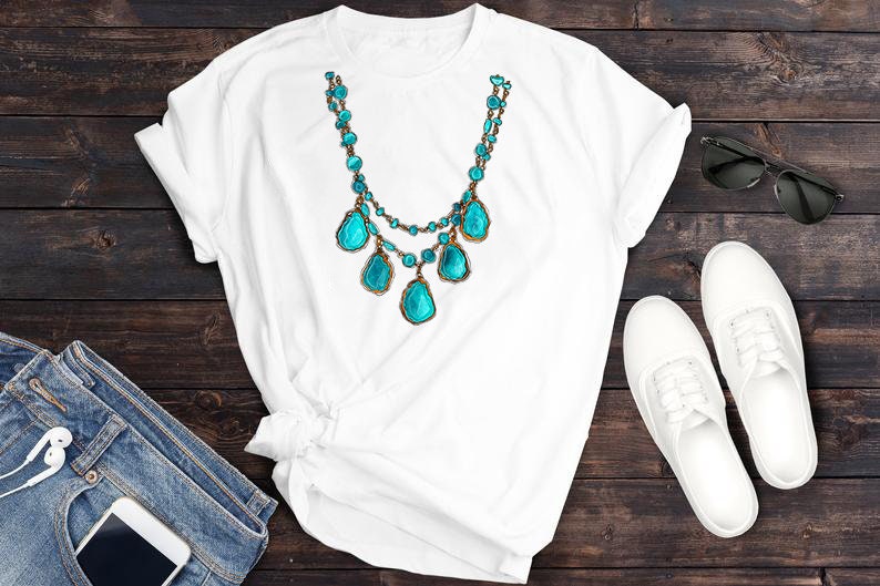 May include: White t-shirt featuring a turquoise and gold necklace with large turquoise stones. The shirt is laid out on a wooden surface with a pair of white trainers and sunglasses.