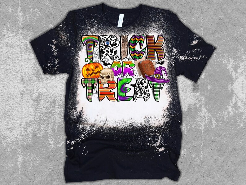 May include: A black t-shirt with a white bleach design featuring the text "Trick or Treat" in colorful patterned letters. The design also includes a pumpkin, skull, witch's hat, and a book.