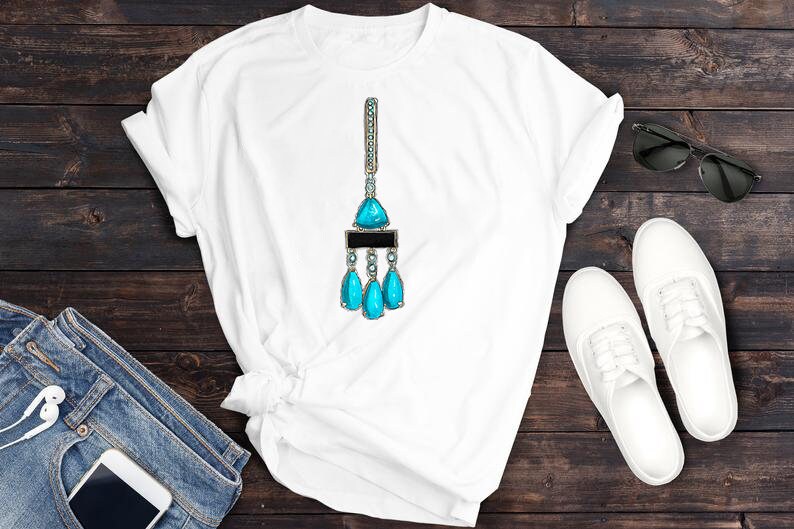 May include: White t-shirt featuring a turquoise blue gemstone pendant necklace design. The necklace has a large triangular gemstone with smaller teardrop-shaped gemstones hanging from it.