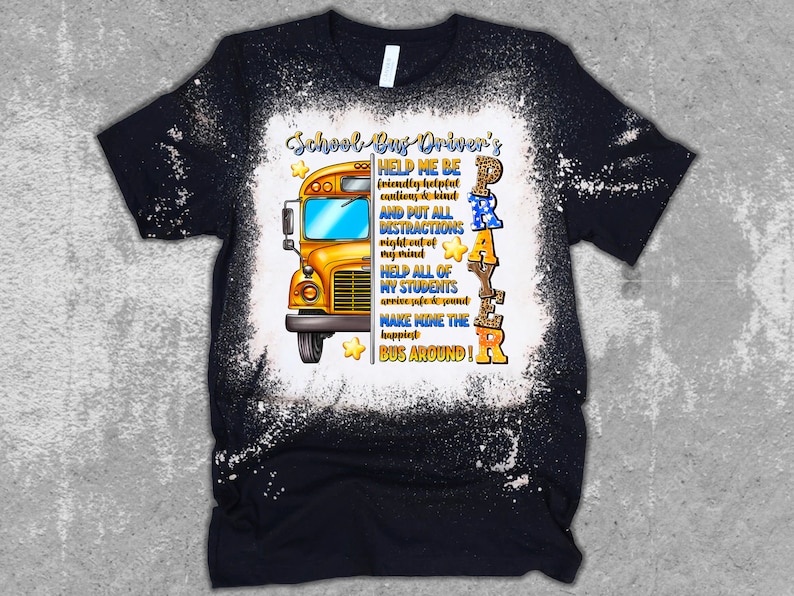 May include: Black t-shirt with a distressed white design. The shirt features a yellow school bus graphic and text that reads "School Bus Driver's Prayer". The prayer includes phrases like "Help me be friendly" and "Make mine the happiest bus around!"
