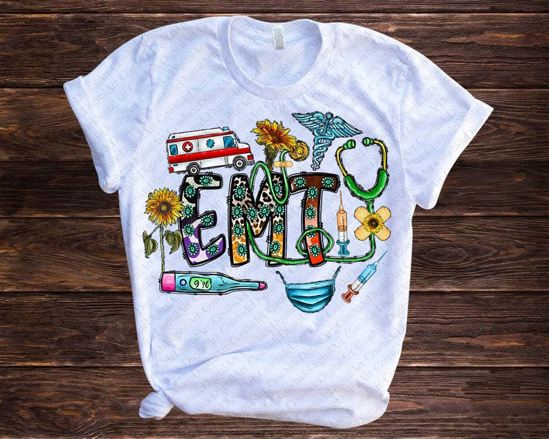 May include: White t-shirt with a colorful graphic design featuring the word "EMT" surrounded by medical symbols, sunflowers, and a leopard print pattern.