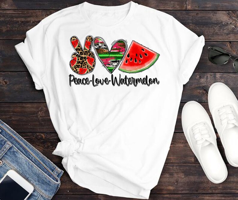 May include: White t-shirt with a peace sign, heart, and watermelon graphic. The text "Peace-Love-Watermelon" is printed below the graphic.