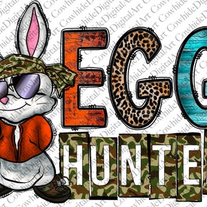 May include: A white rabbit wearing sunglasses and a camouflage bandana stands next to the words "EGG HUNTER" in colourful letters. The letters are decorated with different patterns, including camouflage, leopard print, and wood grain.