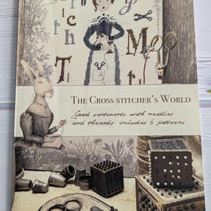 The Cross Stitcher&#39;s World -  Cross Stitch Book of 6 patterns by The Primitive Hare/ 2024 Nashville Needlework Market release