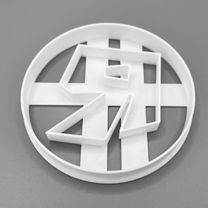 May include: White plastic cookie cutter shaped like the letter R. The cutter has a circular outer edge and a geometric design.