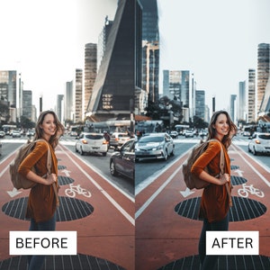 May include: A woman wearing a brown jumper and blue jeans walks down a city street. She is carrying a tan rucksack and smiling at the camera. The street is lined with tall buildings and there are cars parked on both sides.