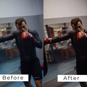 K&ouml;nnte beinhalten: Ein Mann in schwarzer Sportkleidung und roten Boxhandschuhen schl&auml;gt in einem Fitnessstudio auf einen Sandsack ein.