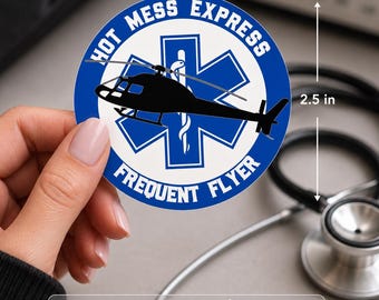 May include: A circular sticker measuring 2.5 inches by 2.5 inches featuring a blue Star of Life emblem with a white medical staff and snake. A black helicopter silhouette is centered over the star. The text reads HOT MESS EXPRESS and FREQUENT FLYER.