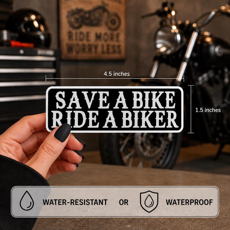 May include: A rectangular black sticker with white text that reads SAVE A BIKE RIDE A BIKER. The sticker measures 4.5 inches in width and 1.5 inches in height. It is labeled as water-resistant or waterproof, featuring a bold, high-contrast design.