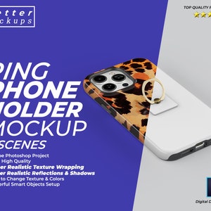 May include: A mockup of a phone case with a ring holder. The case is white with a black trim and has a leopard print design. The ring holder is gold and is attached to the back of the case.