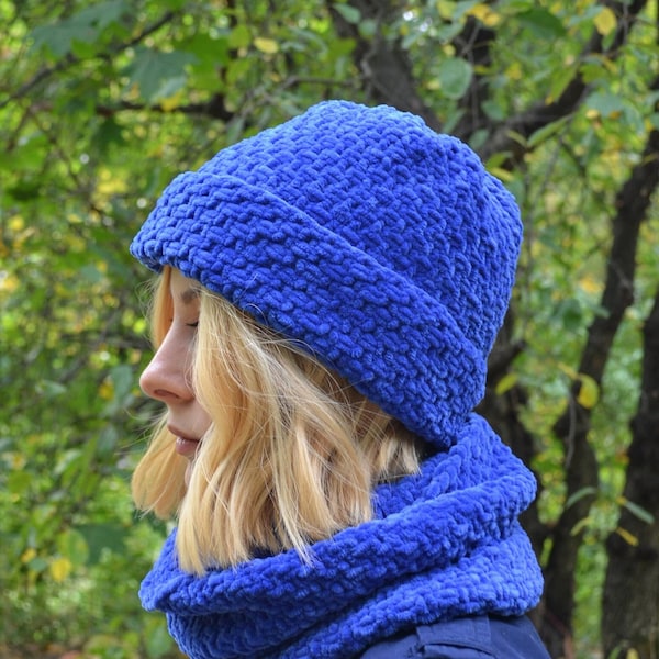 Winter knitted cap and scarf set with traditional embroidery pattern