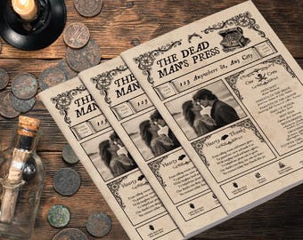 May include: Three vintage-style wedding programs with a sepia tone, featuring a couple kissing. The programs are titled "The Dead Man's Press" and include decorative borders and text. A lit candle, coins, and a bottle are on a wooden surface.