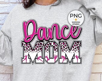 May include: Pale grey sweatshirt featuring the text "Dance MOM" in pink and black. The word "Dance" is in a cursive font, and "MOM" has a leopard print design. The sweatshirt has a crew neck and long sleeves.
