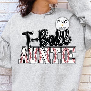 May include: Gray sweatshirt with the text "T-Ball Auntie" in black with a red and white baseball stitch design.
