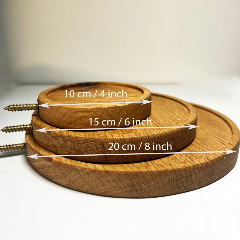 May include: Three wooden round coasters in different sizes. The smallest coaster is 4 inches in diameter, the middle coaster is 6 inches in diameter, and the largest coaster is 8 inches in diameter.