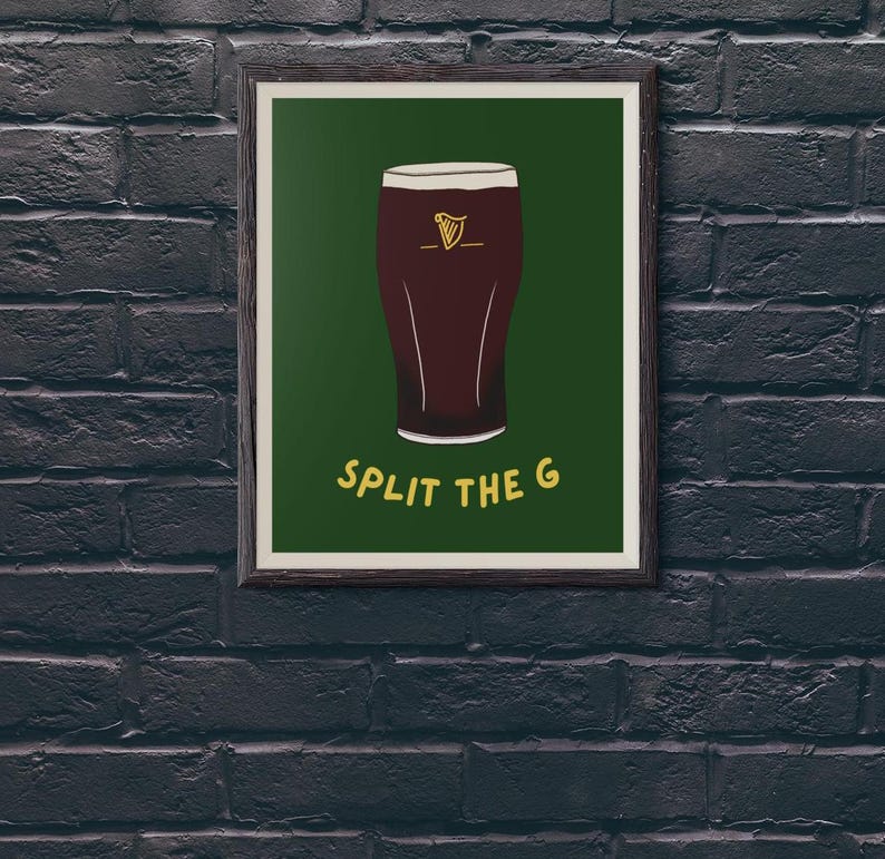 May include: A framed print with a green background featuring a cartoon illustration of a glass of dark beer with the text "SPLIT THE G" in yellow.