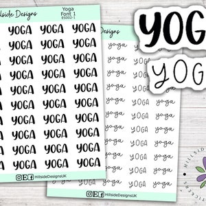 May include: A sheet of stickers featuring the word "YOGA" in various fonts and styles. The stickers are white with black lettering. The sheet is displayed against a light wood background.