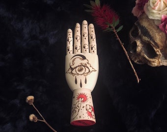 Articulated wood hand tattooed oldschool style