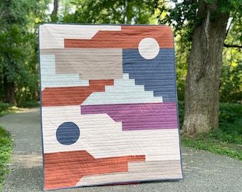 Sundance Quilt kit by Wellspring Designs Quilting, featuring poplin, essex linen and sprout wovens in rusty and aubergine earth tones