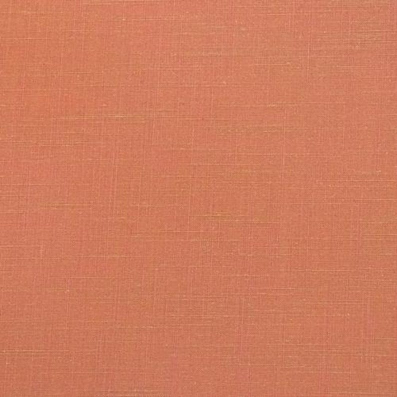 May include: A close-up of a solid coral orange fabric with a subtle woven texture.